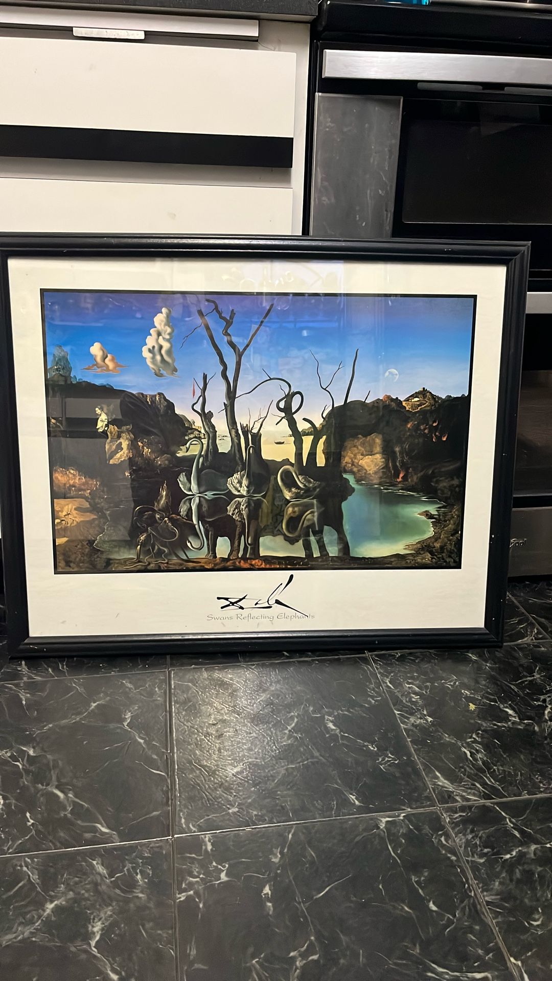 Print of 1937 painting by Salvador Dali of swans reflecting elephants
