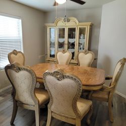Antique dining room table with 6 chairs and matching hutch/buffet