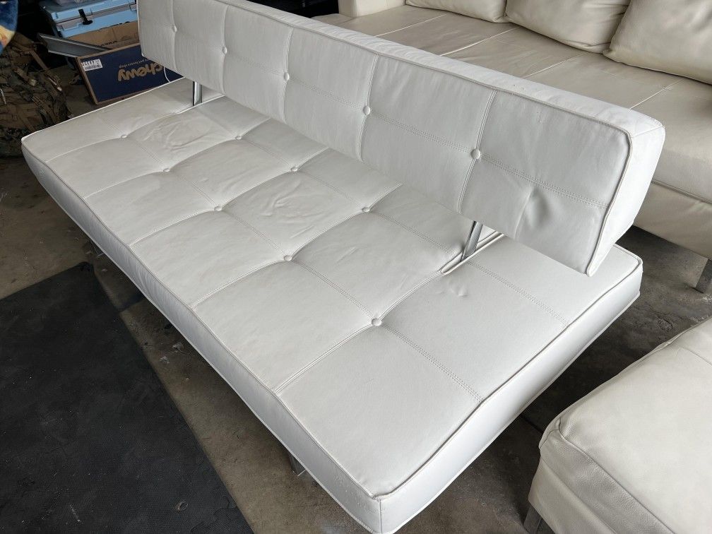 White leather couch and futon