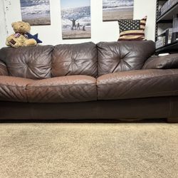Genuine leather sofa; fair condition—shows scuffs and normal wear. Free to a good home.