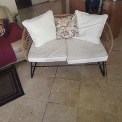 Hand - made Wicker, black steal frame and slates,  w/ cozy cushions and pillows included