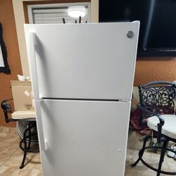 White GE Refrigerator 64,"height and 28 " wide
