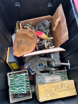 Box of vintage fishing gear.