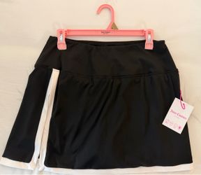 This is a black Juicy Couture Sport athletic skort featuring a contrasting white side stripe and built-in shorts. Size LARGE