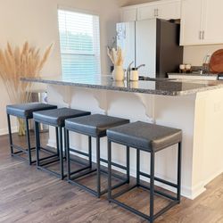 New Set of 4 PHI VILLA 24'' Backless PU Leather Bar Stools for Kitchen Island with Sturdy Metal Frame-  New in box IF-570-2-BK Add modern comfort and 