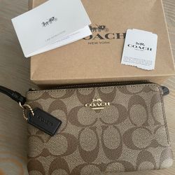 Brand New Coach Wristlet. Two Zippered Compartments.