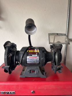 Bench grinder with wire wheel