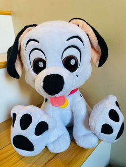 Disney 101 Dalmatians patch big feet with black spots on white fur.