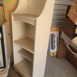 2 White matching book shelves . 