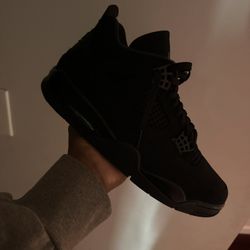 Black cat jordan 4s