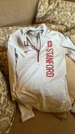 This grey Nike Stanford Cardinal Dri-FIT half-zip pullover features the university name printed vertically on the chest