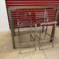 Stilt 42" High Dining Table and Set of Clear Stools