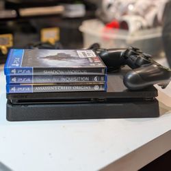 Sony PS4 and three games.