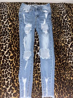 Light blue ripped denim jeans