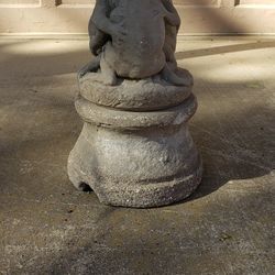 Three frogs under umbrella fountain