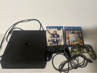 PS4 with 2 controllers and 2 games