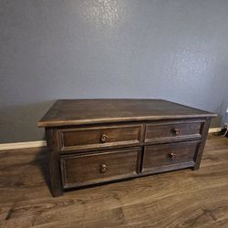 Ashley Coffee Table With Expandable Lid And Roller Wheels