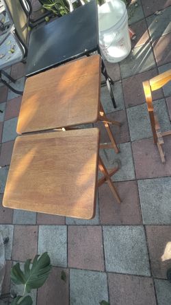 Three small portable tables