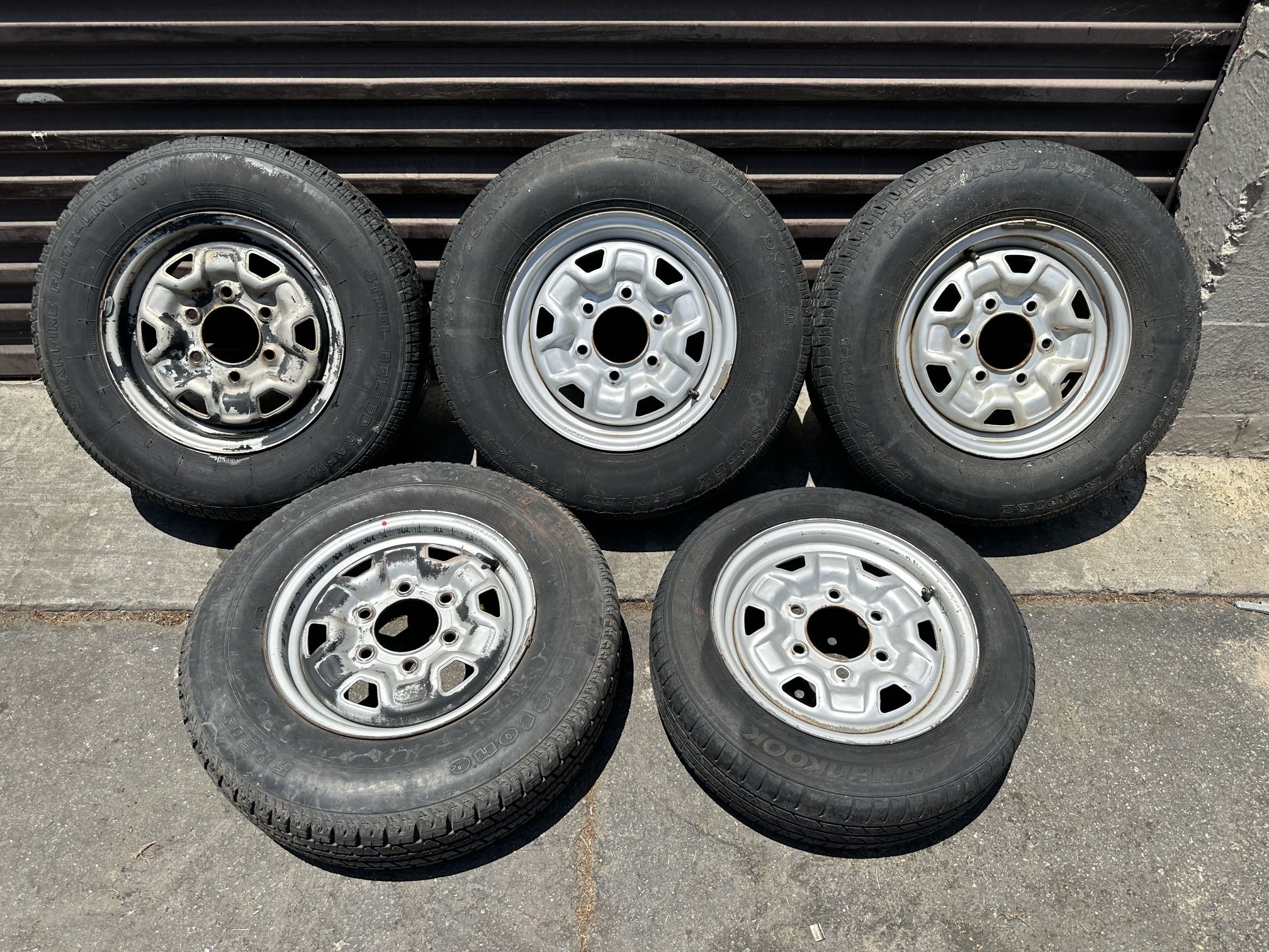 Five 14 inch steel 6 lug wheels Mazda b2200 and more