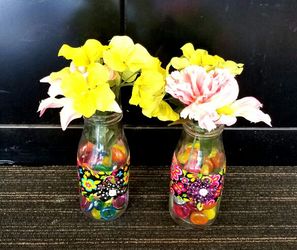 2 milk bottles with colorful glass embellishments