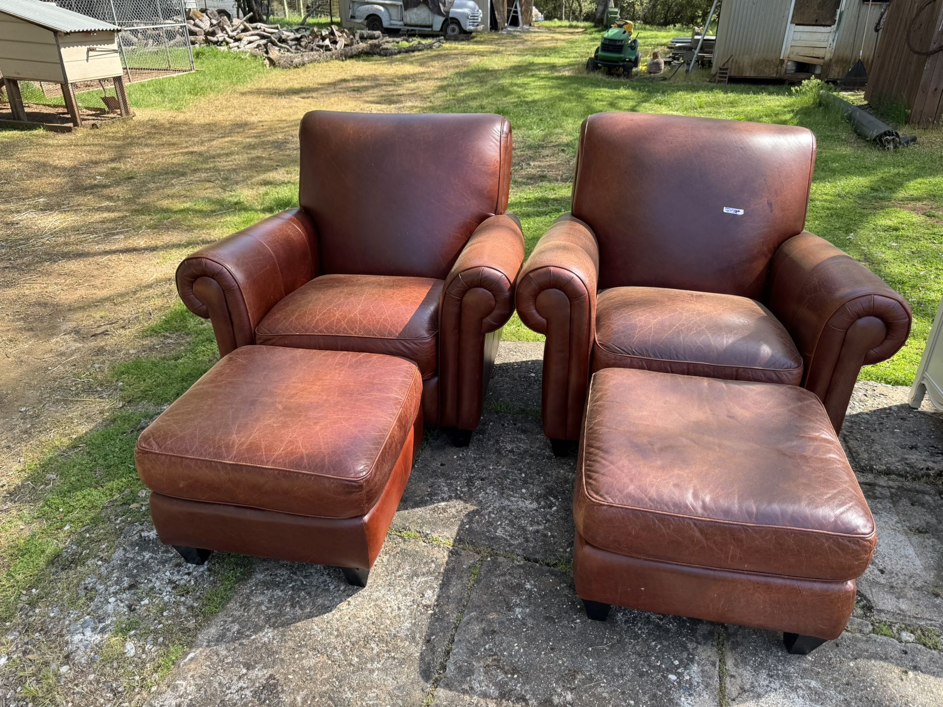 Two Chairs With Ottomans