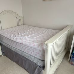 Full-size bed able to convert to crib