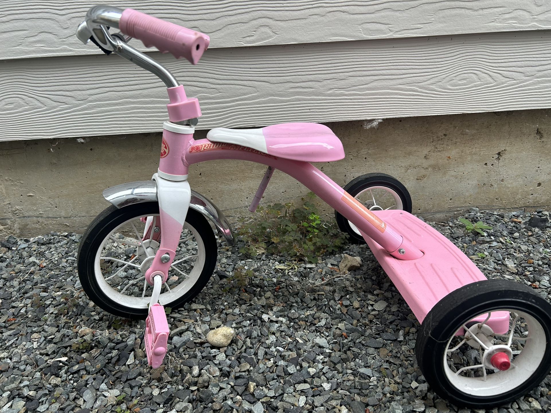 Pink Radio Flyer tricycle