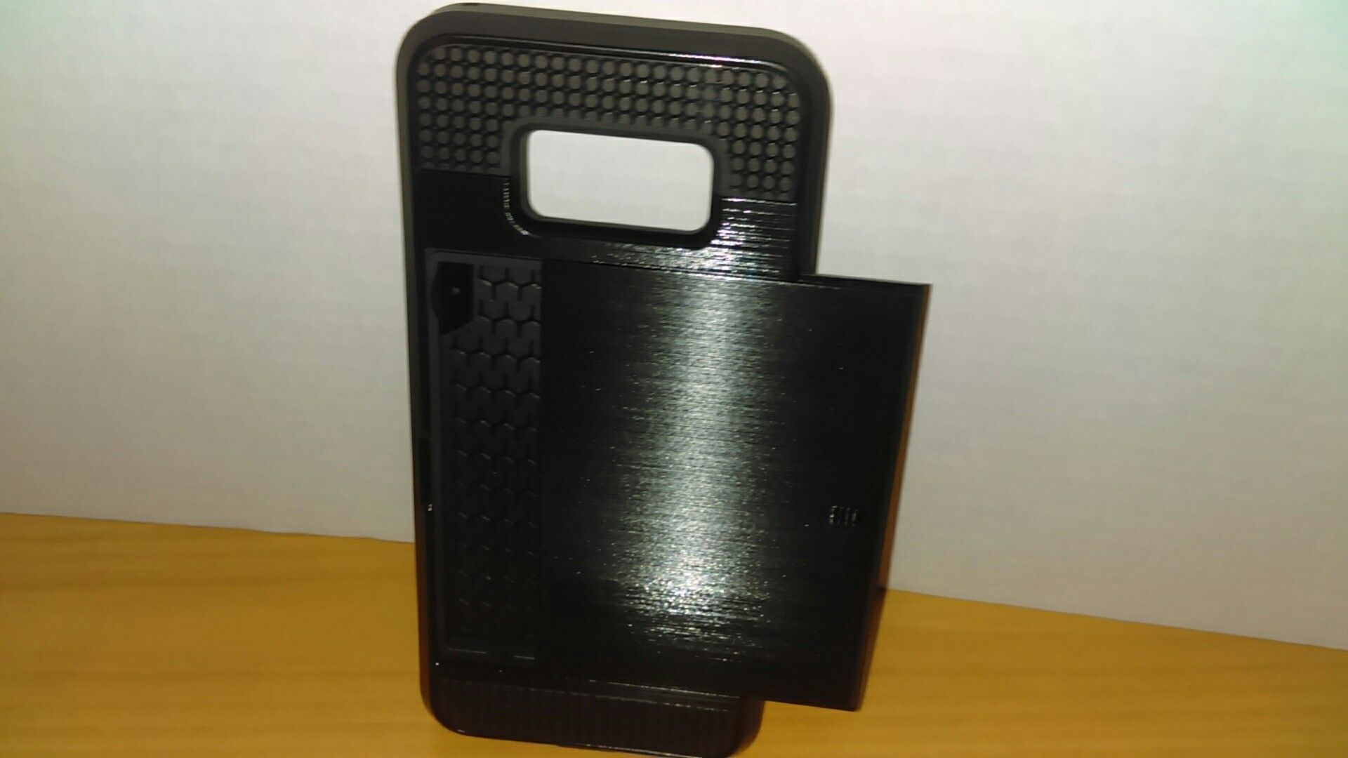 Black Phone Case with back sliding compartment.