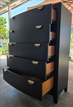 Beautiful tall black dresser.