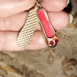 Vintage brass shoe pendant with red CZ stones
