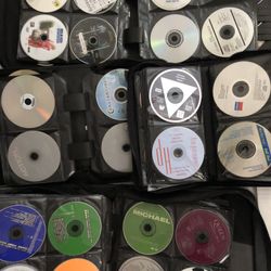 4 Binders Full Of Dvds And CDs Binders Included