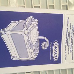 Graco playard with changing table and newborn bassinet & napper.