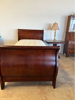 Cherry Wood Sleigh Bed Frame.  Overall length and width  87” x 42” headboard height is 44 inches and footboard is 34 inches. Pillow top deep reversibl