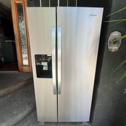Used, Whirlpool 2-door refrigerator, one year old; see photos.
