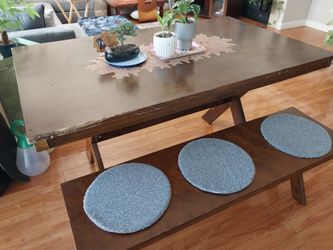 Wooden dining table with bench