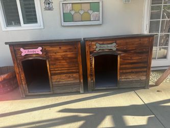 Two wood dog houses.