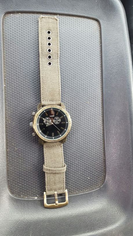 QUARTZ ACCUTIME WATCH CORP. Stainless Steel Caseback
