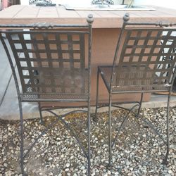 Iron barstools and bistro pub table