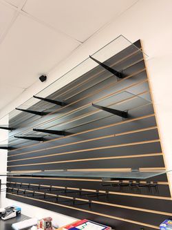Slatwall Display Wall with Glass Shelves and Hooks