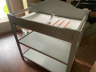 Graco changing table-color grey with mattress/seat belt attached