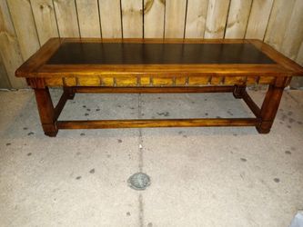Vintage coffee table 55 x22. Wood and leather