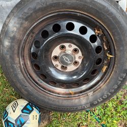 Set Of Four Tires And Rims For A Chevy 235 55/17
