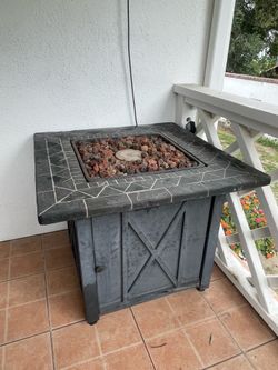 Outdoor fire pit table