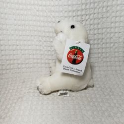 Coca cola Collectible bear with tags .