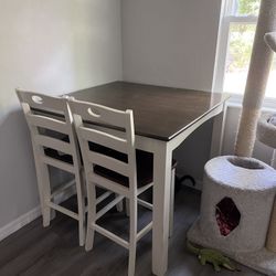 Woodanville dining table and 4 online chairs