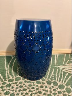 Blue carved metal plant stand