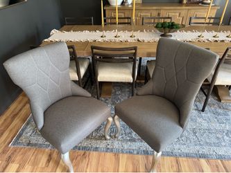 Dark gray upholstered side chair with silver finish cabriole legs.  $250 for set of 2