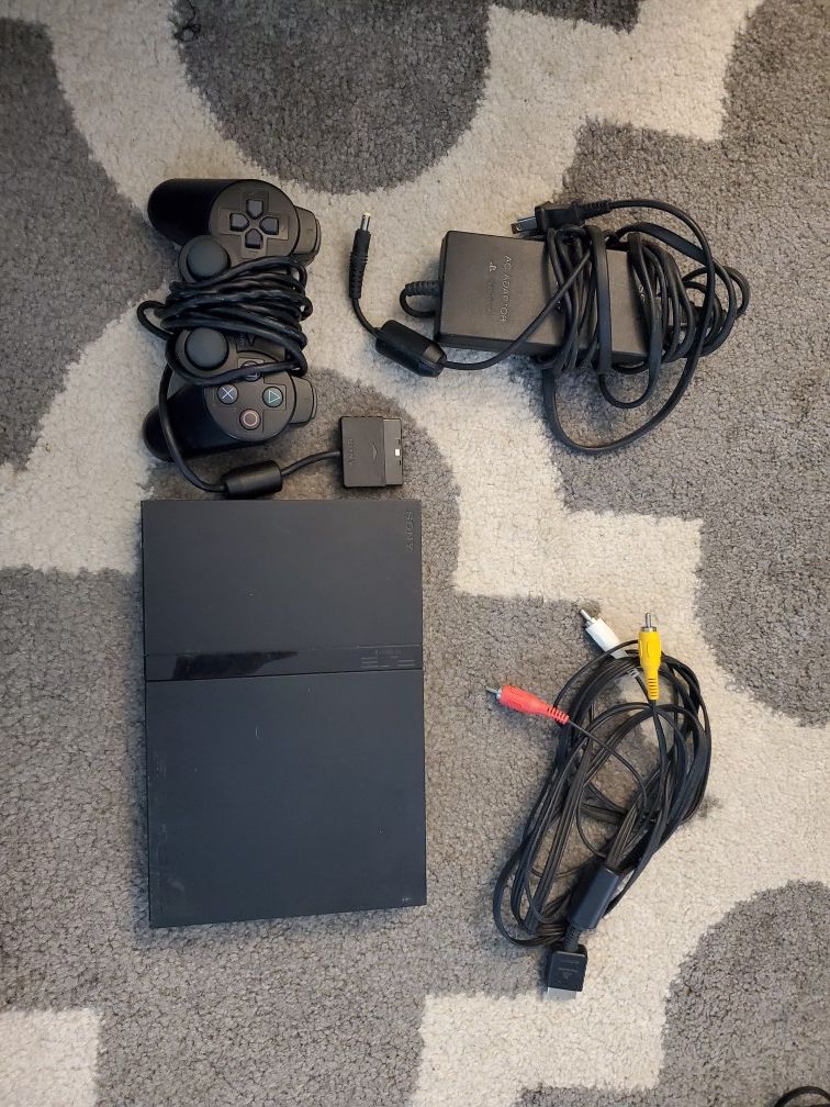 Playstation 2 slim + extras