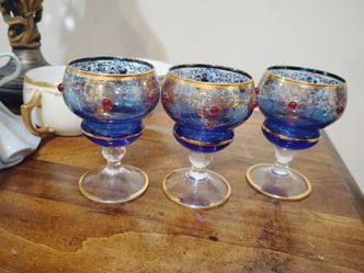 Antique Victorian Blue Glass Goblet with Gilded and Ruby Detailing with gold trim.