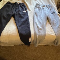 two pairs puma sweat pants 